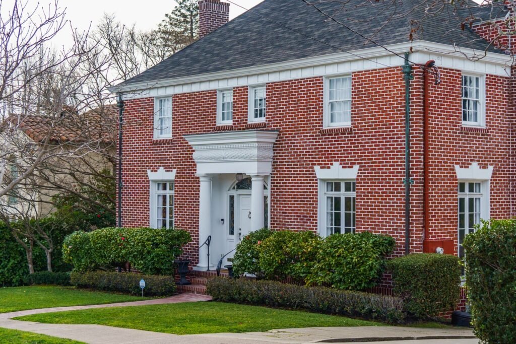Brick center-hall colonial home, a common house style in Jericho, NY