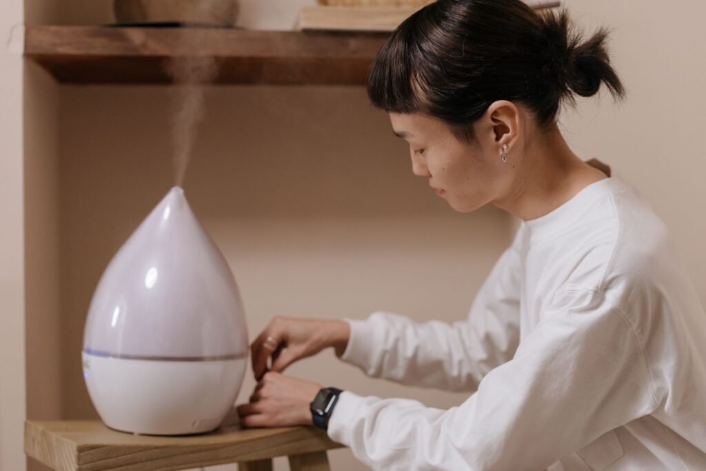 Homeowner adjusting a humidifier to improve indoor air quality