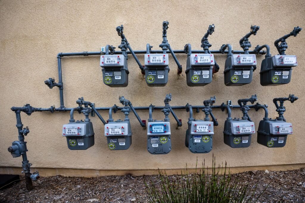 Natural gas meters and piping on a building exterior